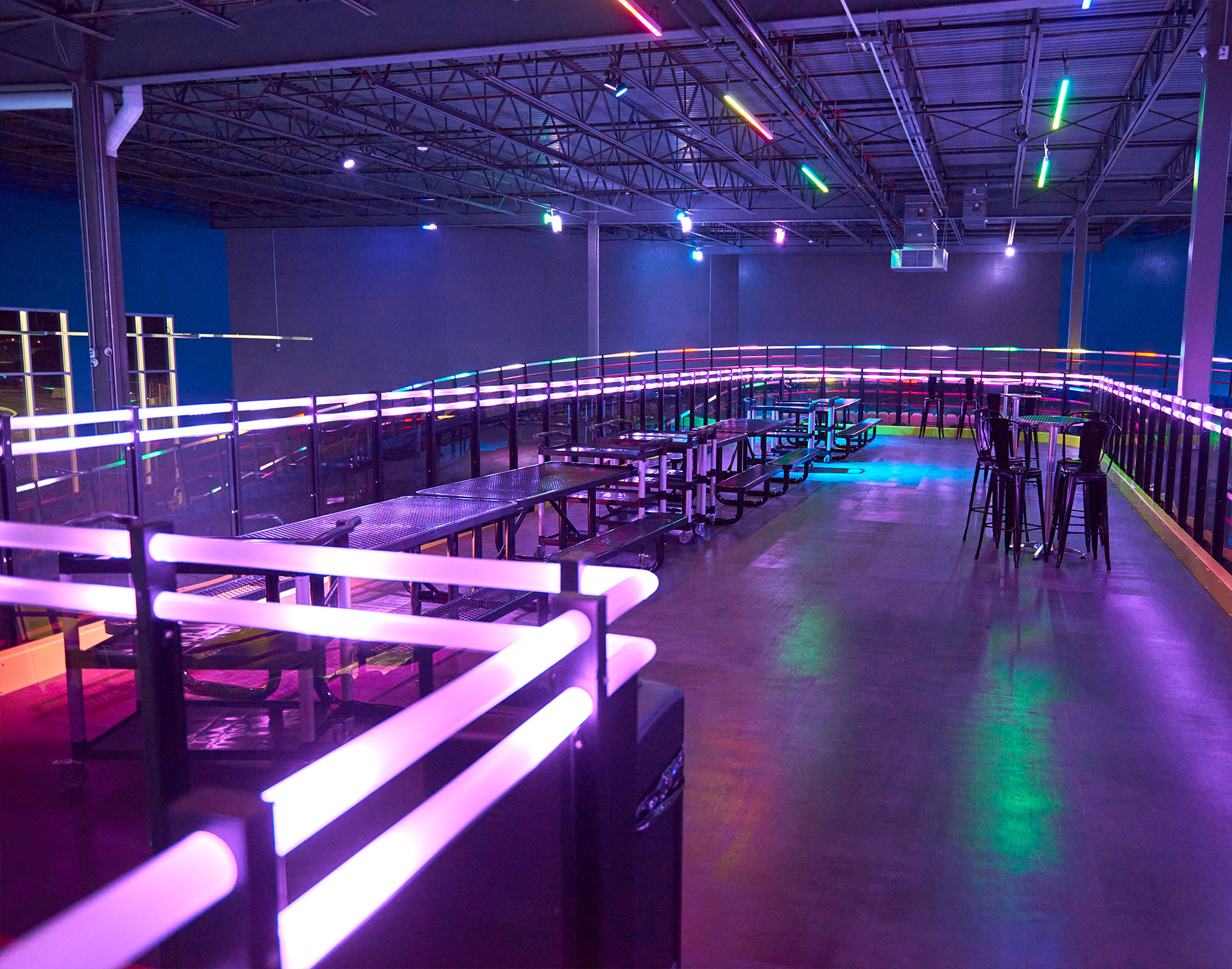 LED lighting integrated into the barriers of an indoor karting track