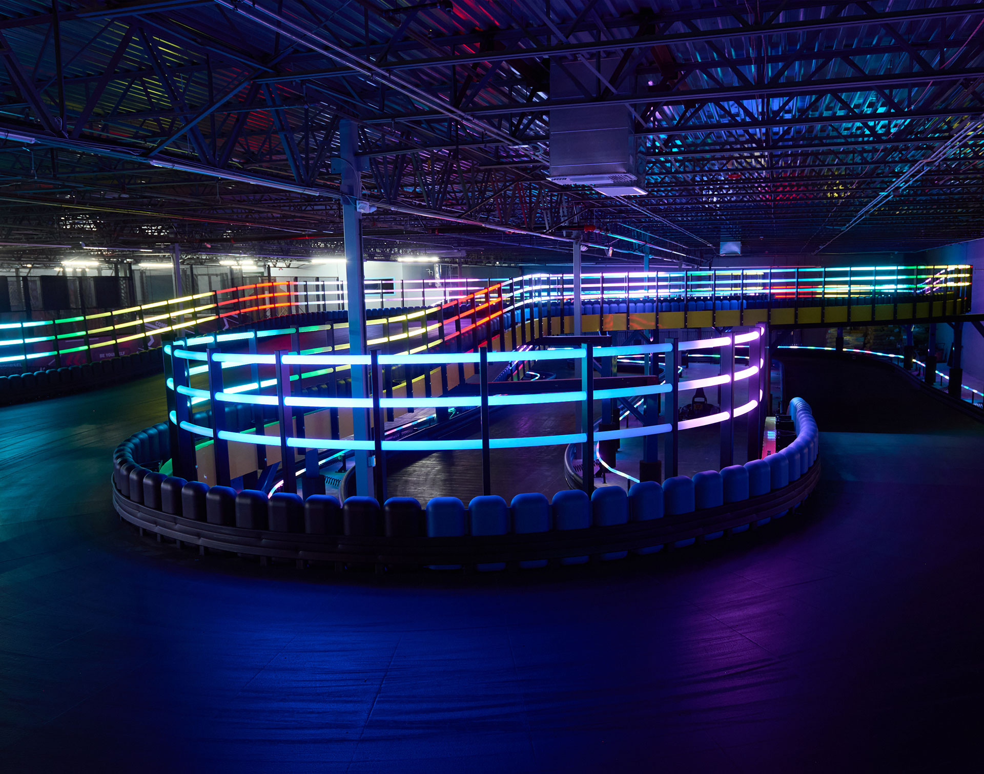Custom coloured railings running along a karting track