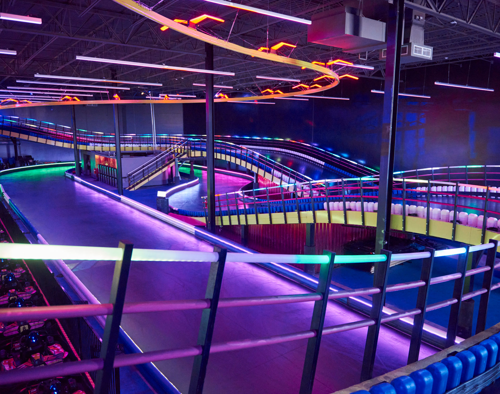 Custom steel stairs giving access to an elevated karting track level